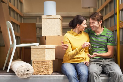 Careful packing of fragile household items by a Stroudgreen moving team